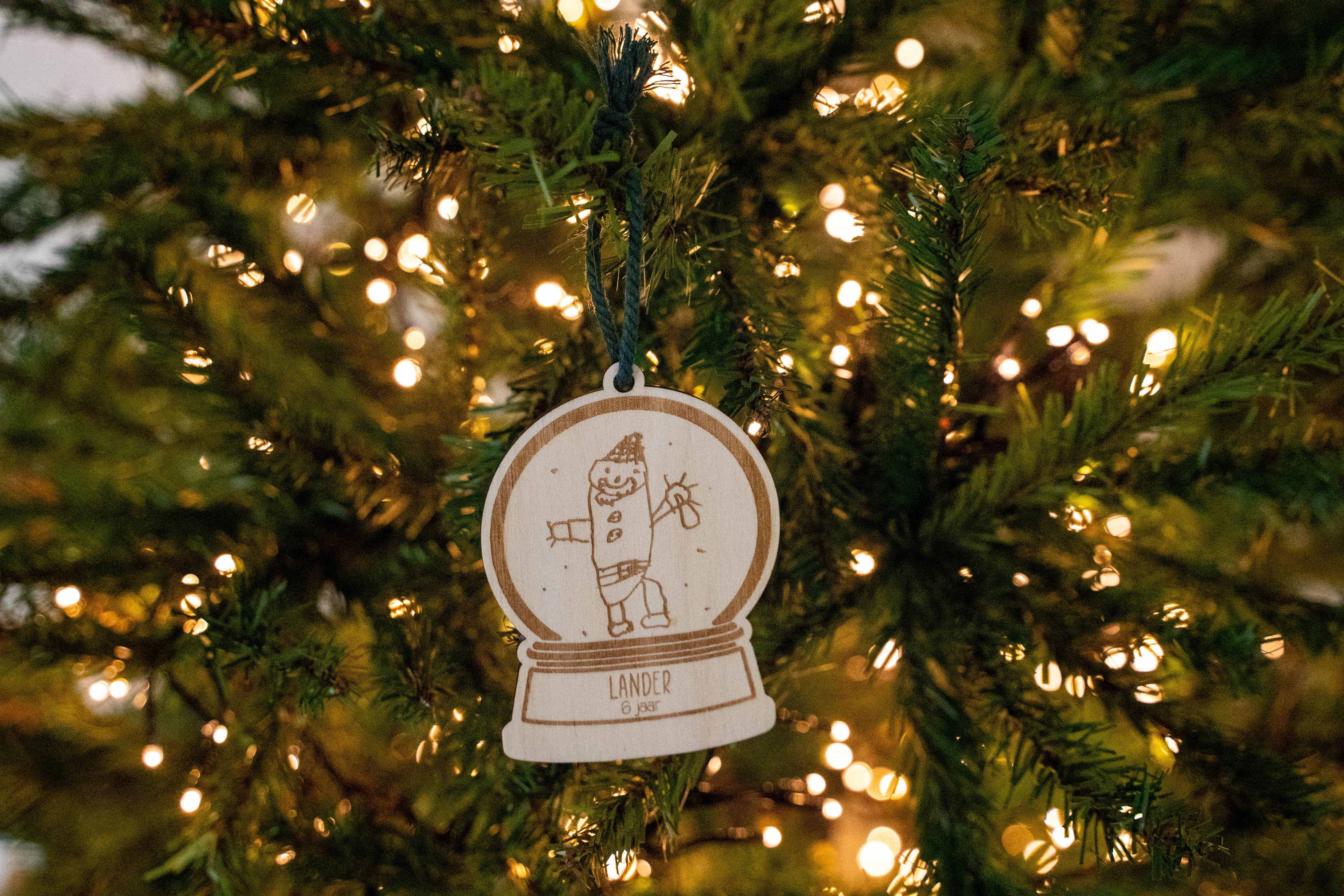 Sneeuwbol hout met tekening kind